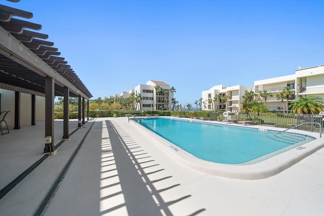 view of swimming pool with a patio