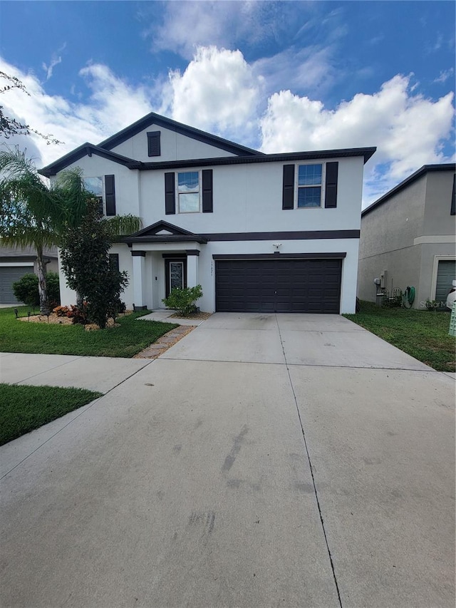 front of property with a garage