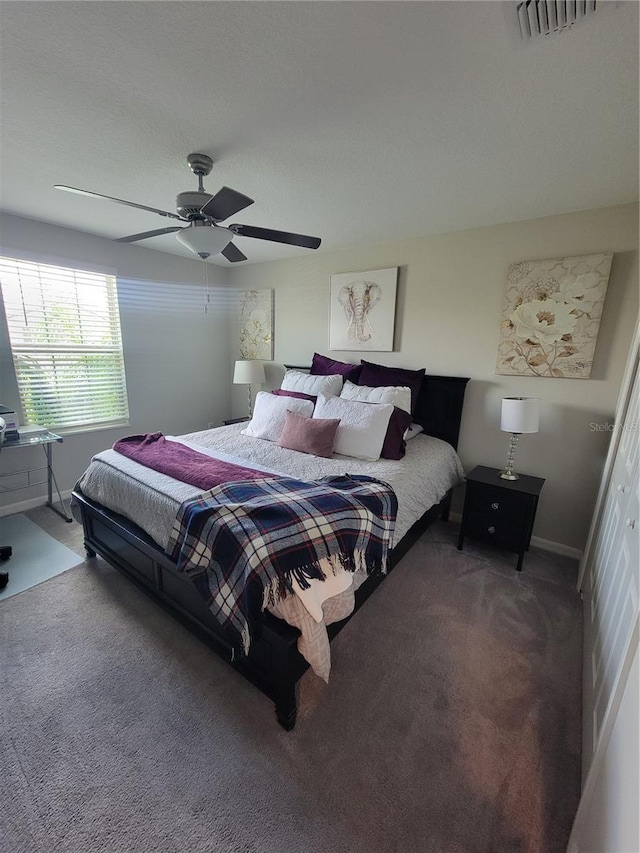 carpeted bedroom featuring ceiling fan