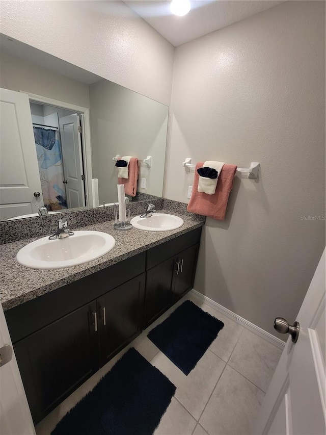 bathroom with tile patterned flooring and vanity