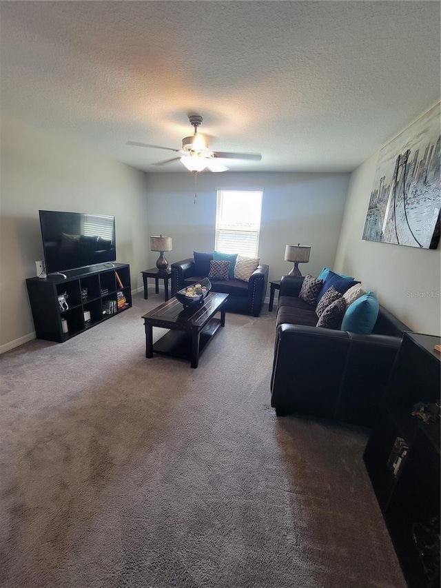 carpeted living room with a textured ceiling and ceiling fan