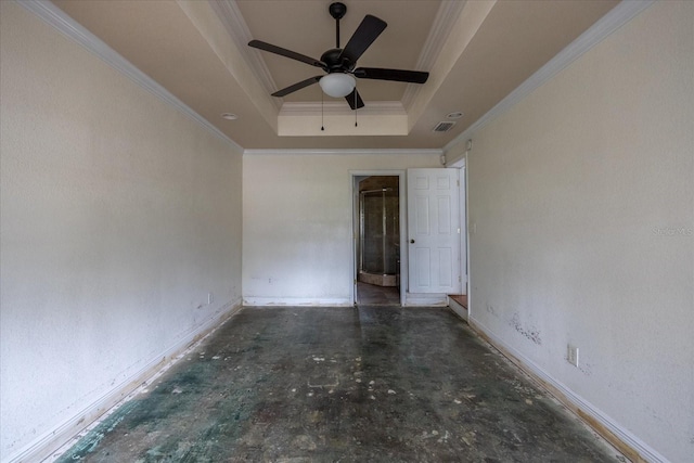 unfurnished room featuring ceiling fan, a raised ceiling, and crown molding