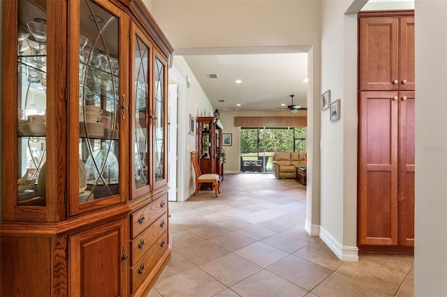 hallway with light tile patterned floors