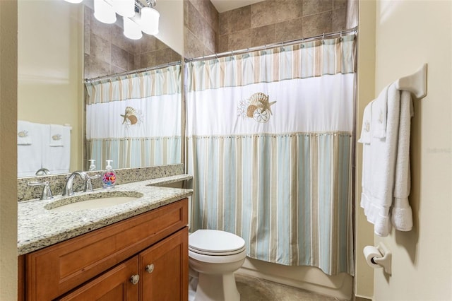 full bathroom featuring vanity, shower / tub combo, and toilet