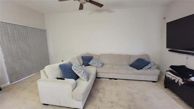 carpeted living room featuring ceiling fan