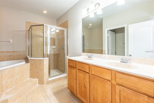 bathroom featuring vanity, tile patterned floors, and separate shower and tub