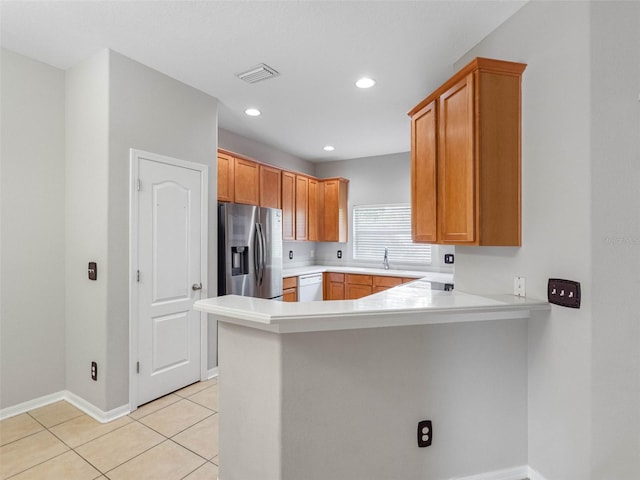 12820 Belvedere Song Way, Riverview, FL 33578 - kitchen featuring stainless steel refrigerator with ice dispenser, dishwasher, a peninsula, light countertops, and light tile patterned floors