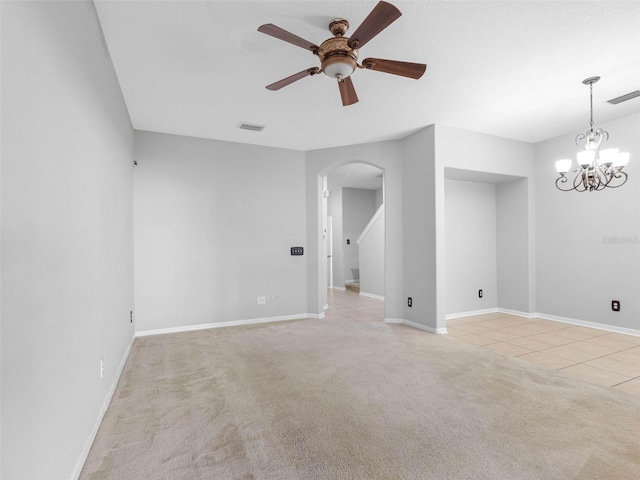 12820 Belvedere Song Way, Riverview, FL 33578 - unfurnished room with arched walkways, light carpet, a ceiling fan, light tile patterned flooring, and a chandelier