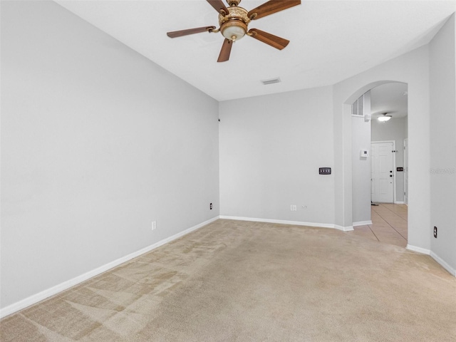 12820 Belvedere Song Way, Riverview, FL 33578 - spare room with arched walkways, light carpet, and a ceiling fan