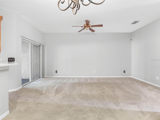 12820 Belvedere Song Way, Riverview, FL 33578 - unfurnished room with light carpet, ceiling fan, and a chandelier