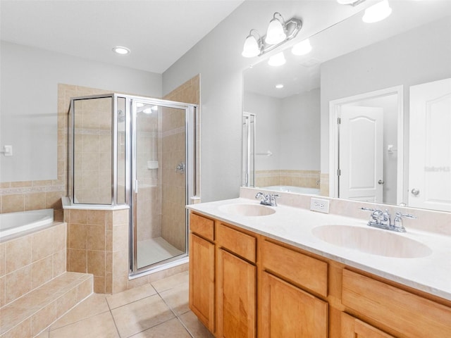 12820 Belvedere Song Way, Riverview, FL 33578 - bathroom with a garden tub, a stall shower, tile patterned floors, and double vanity