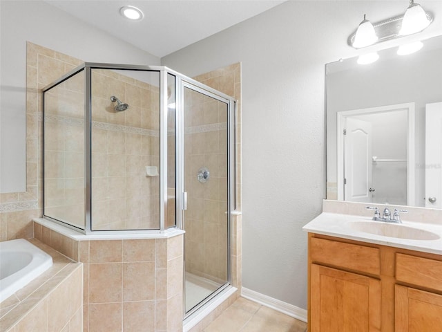 12820 Belvedere Song Way, Riverview, FL 33578 - full bathroom with a stall shower, a garden tub, vanity, and tile patterned floors