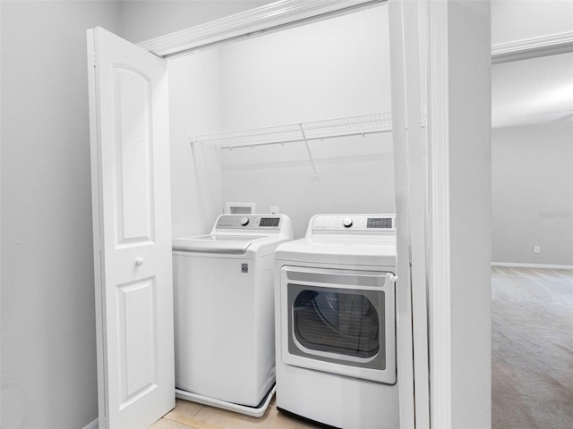 12820 Belvedere Song Way, Riverview, FL 33578 - laundry area with washing machine and clothes dryer and light colored carpet