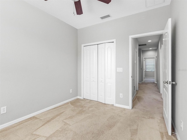 12820 Belvedere Song Way, Riverview, FL 33578 - unfurnished bedroom featuring light colored carpet, a closet, and a ceiling fan