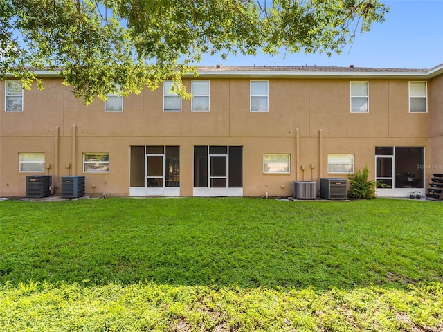 12820 Belvedere Song Way, Riverview, FL 33578 - rear view of house with a lawn and stucco siding