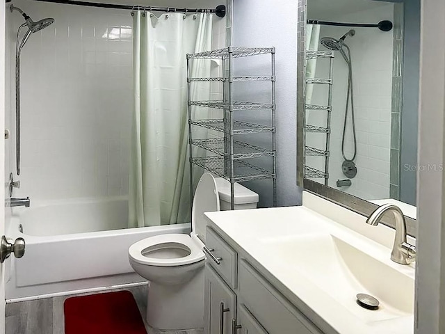 full bathroom with shower / bath combination with curtain, vanity, and toilet