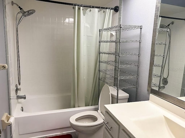 full bathroom with shower / bath combo, vanity, and toilet