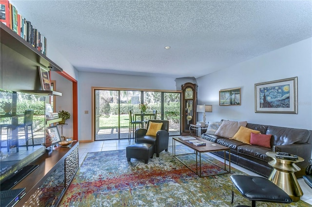 living room featuring a textured ceiling and light tile patterned flooring