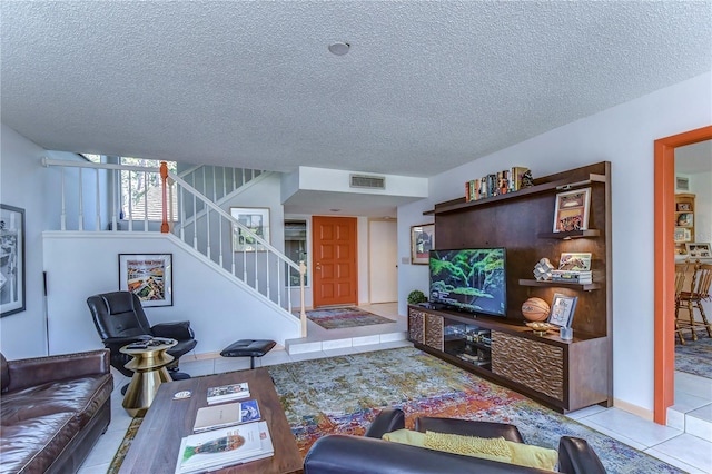 tiled living room with a textured ceiling