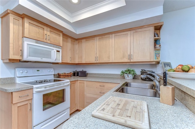 kitchen featuring white appliances, sink, and light brown cabinets