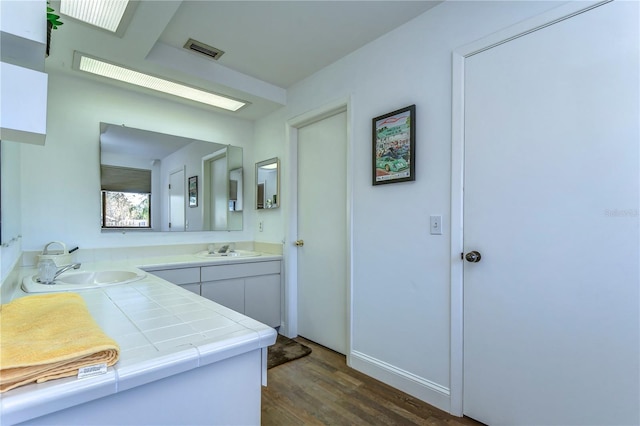 bathroom featuring wood-type flooring and vanity