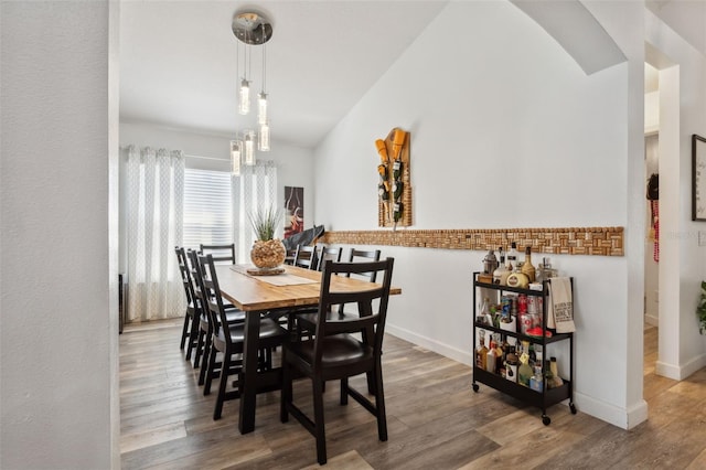 dining area with wood-type flooring