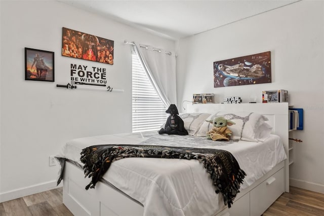 bedroom featuring hardwood / wood-style floors