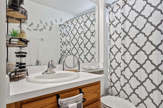 bathroom with vanity, toilet, and a shower with shower curtain