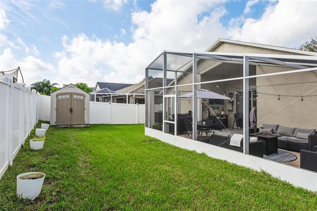 view of yard featuring an outdoor living space, glass enclosure, a storage unit, and a patio area