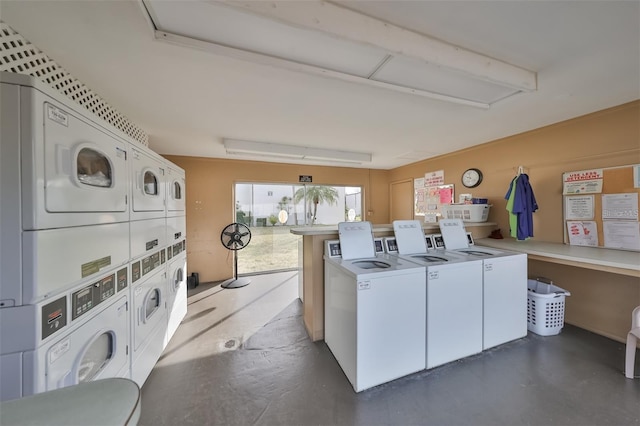 laundry room featuring stacked washer and clothes dryer and independent washer and dryer