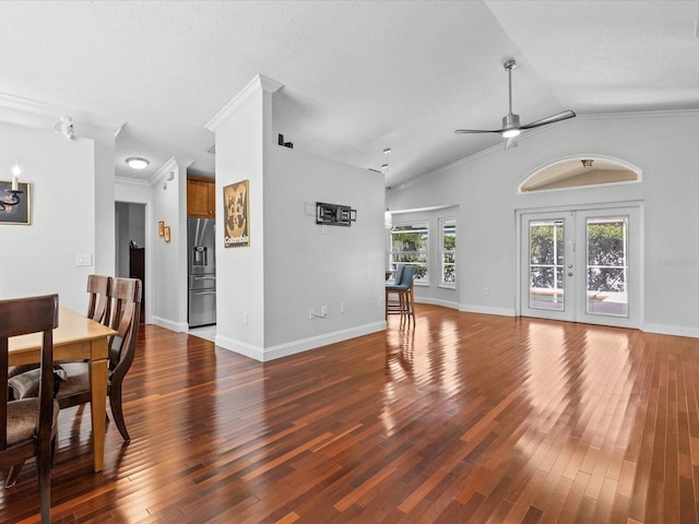 dining room with french doors, ceiling fan, dark wood-type flooring, and crown molding