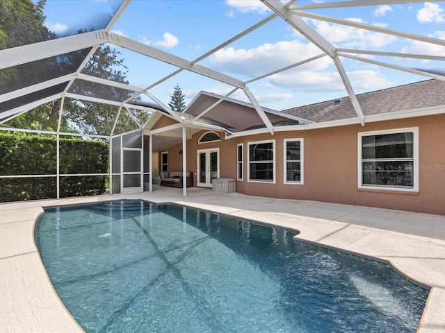 view of pool with a lanai and a patio