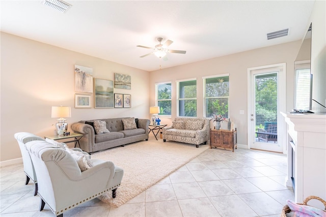 living room with light tile patterned floors and ceiling fan