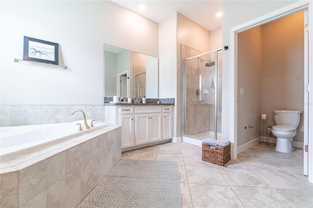 full bathroom featuring vanity, toilet, separate shower and tub, and tile patterned flooring