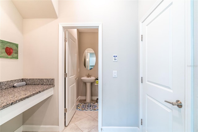 bathroom featuring sink and tile patterned flooring