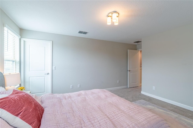 bedroom featuring light colored carpet