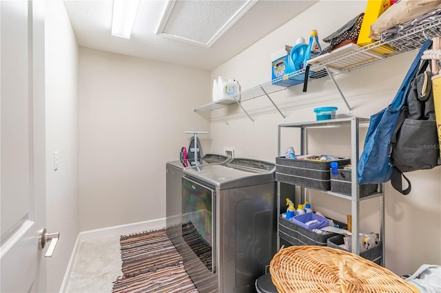 clothes washing area featuring washing machine and clothes dryer