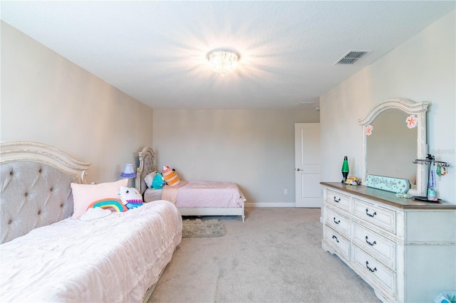 carpeted bedroom with a textured ceiling