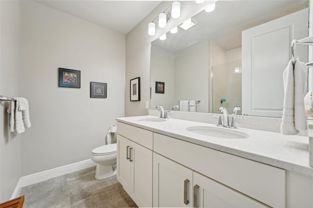 bathroom with a shower, vanity, and toilet