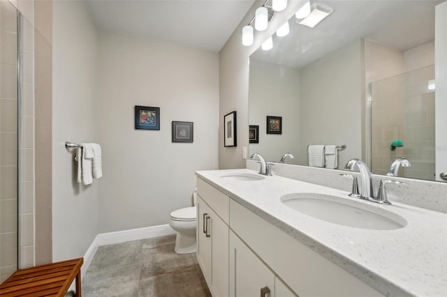 bathroom featuring walk in shower, vanity, toilet, and tile patterned floors