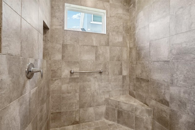 bathroom featuring tiled shower