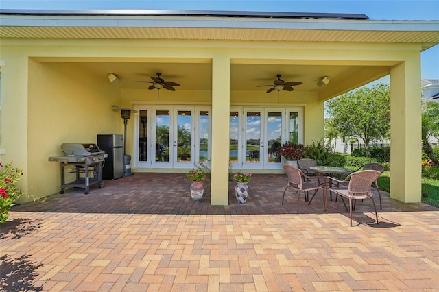 view of patio with grilling area, ceiling fan, and french doors