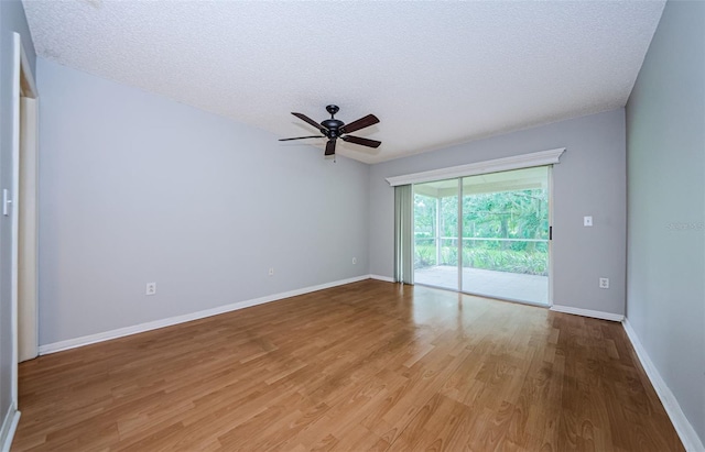 unfurnished room featuring ceiling fan, a textured ceiling, and light wood-type flooring