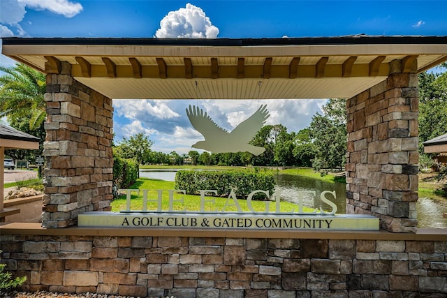 community sign with a water view