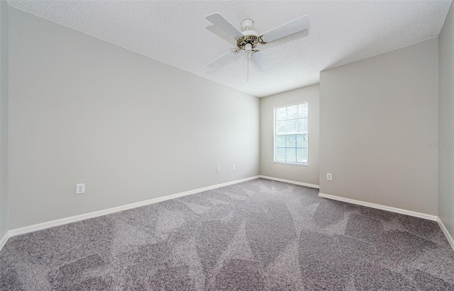 carpeted spare room featuring ceiling fan and a textured ceiling