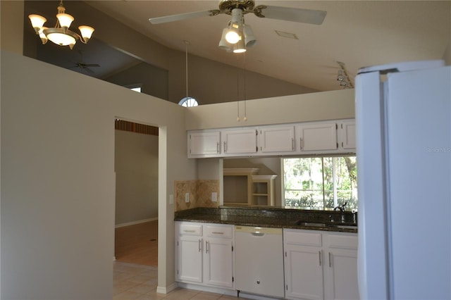 kitchen with white cabinets, dark stone counters, sink, and dishwasher