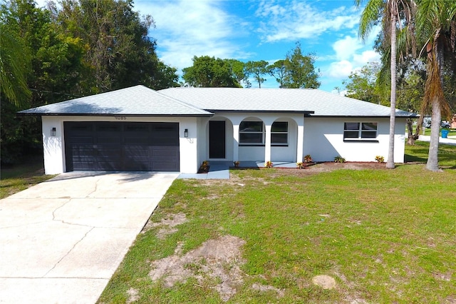 9085 Dorsey St, Spring Hill, FL 34608 - ranch-style home featuring an attached garage, a front yard, driveway, stucco siding, and a shingled roof