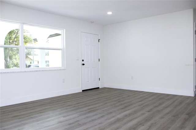 9085 Dorsey St, Spring Hill, FL 34608 - spare room featuring wood finished floors, recessed lighting, and baseboards