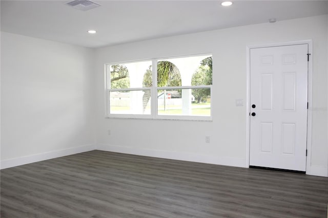 spare room featuring dark hardwood / wood-style floors