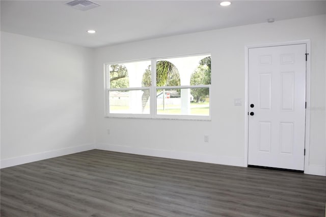 9085 Dorsey St, Spring Hill, FL 34608 - empty room featuring dark wood-style floors, recessed lighting, and baseboards